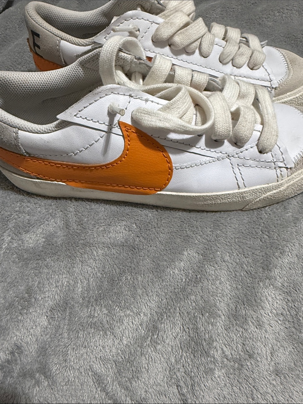Nike Kids White Sneakers with Orange Swoosh